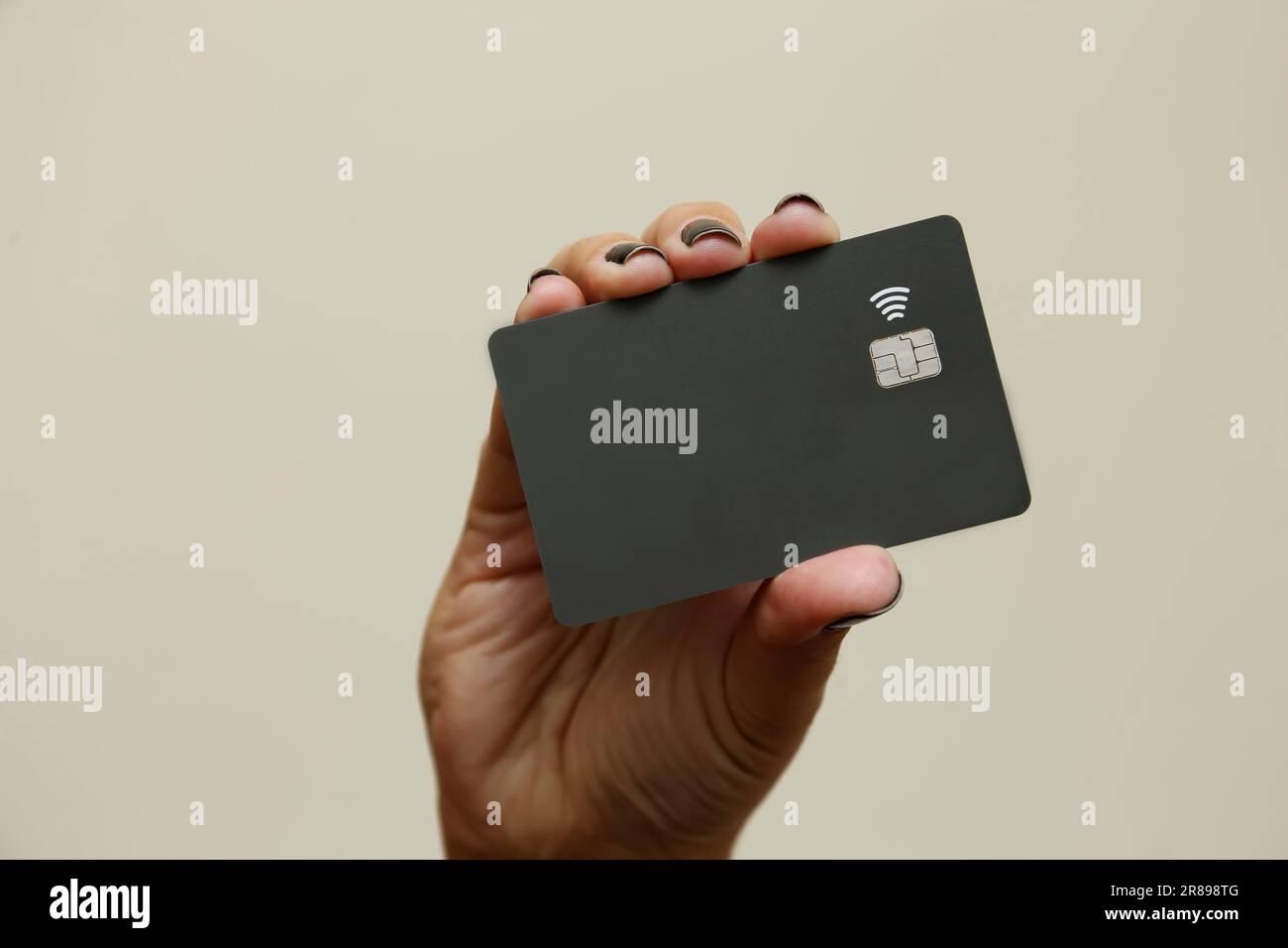 black credit or debit contactless card with contact less sign. Digital payment system. Stock Photo