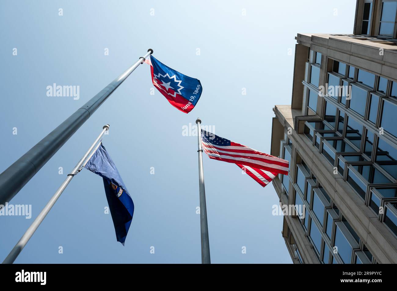 NASA HQ Juneteenth Flag Raising Ceremony. The Juneteenth flag is seen waving in the wind during a flag raising ceremony in recognition and celebration of Juneteenth, Thursday, June 15, 2023, at the Mary W. Jackson NASA Headquarters building in Washington. Stock Photo