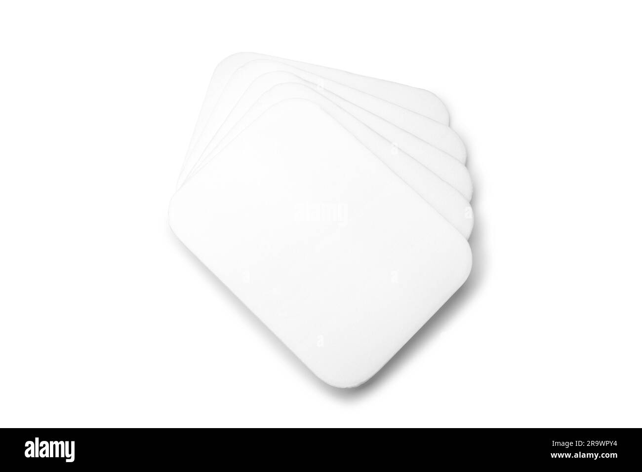 Stack of flat white foam trays isolated on white background Stock Photo