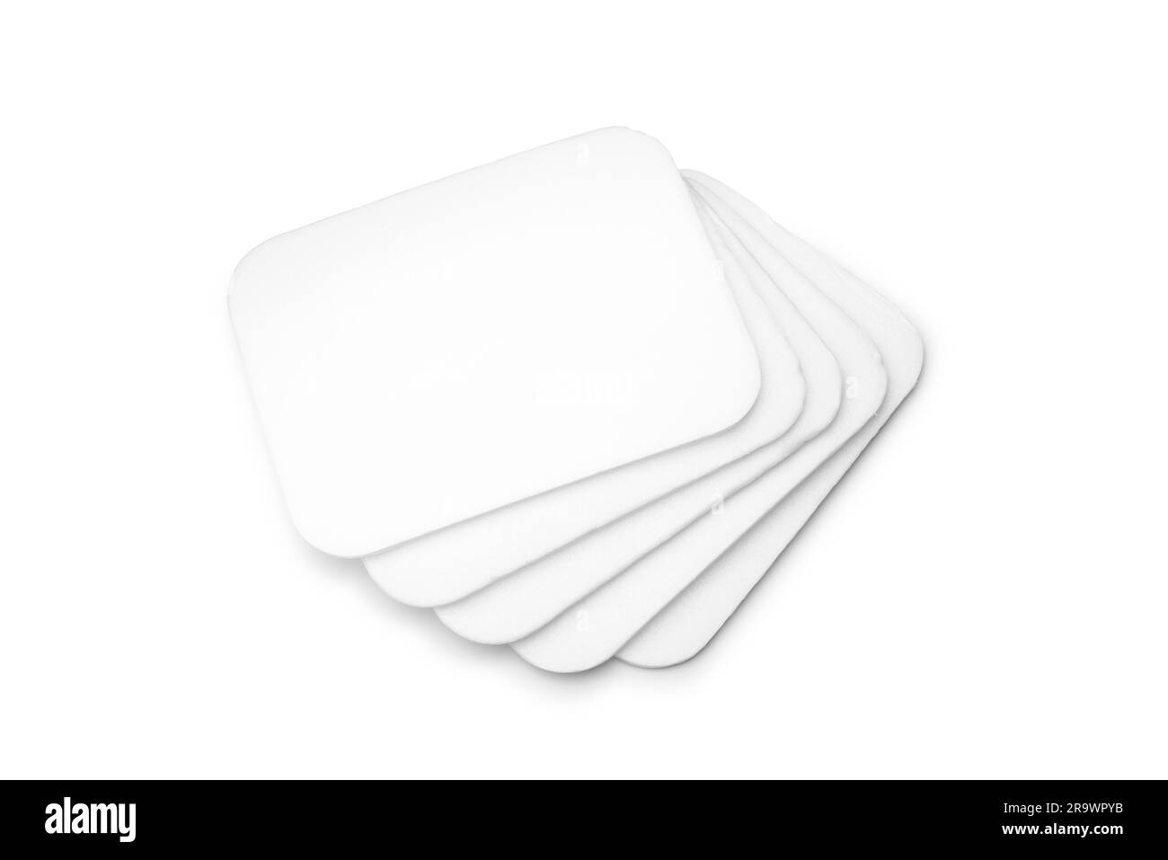 Stack of flat white foam trays isolated on white background Stock Photo