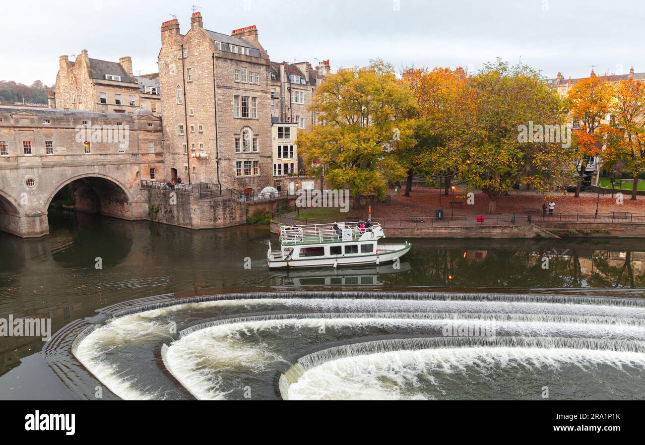 Bath, United Kingdom - November 1, 2017: Ferry with passengers goes near the 18th century Pulteney Bridge, Bath old town view Stock Photo