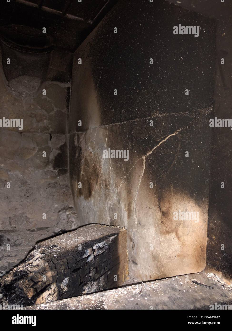 Broken firebrick in a tiled stove. Stock Photo