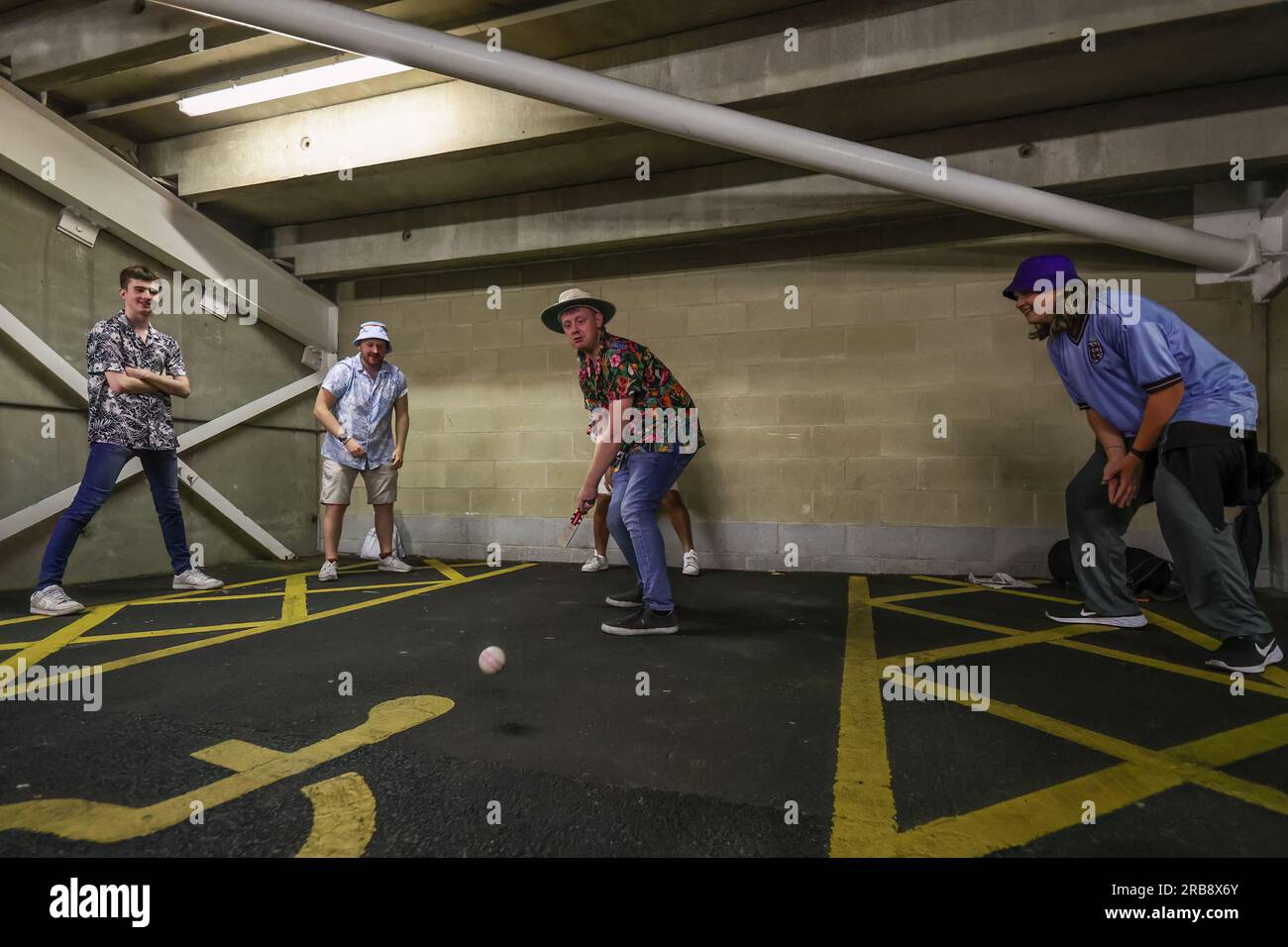 A group of people play cricket under the back of the stand during the LV= Insurance Ashes Third Test Series Day 3 England v Australia at Headingley Stadium, Leeds, United Kingdom, 8th July 2023  (Photo by Mark Cosgrove/News Images) Stock Photo