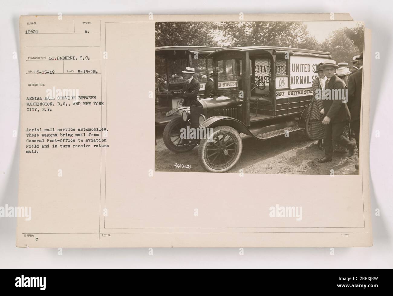 A fleet of aerial mail service automobiles are seen in this photograph taken on May 15, 1918. These vehicles were used to transport mail between Washington, D.C., and New York City, N.Y. They brought mail from the General Post-office to the Aviation Field and received return mail in turn. Stock Photo