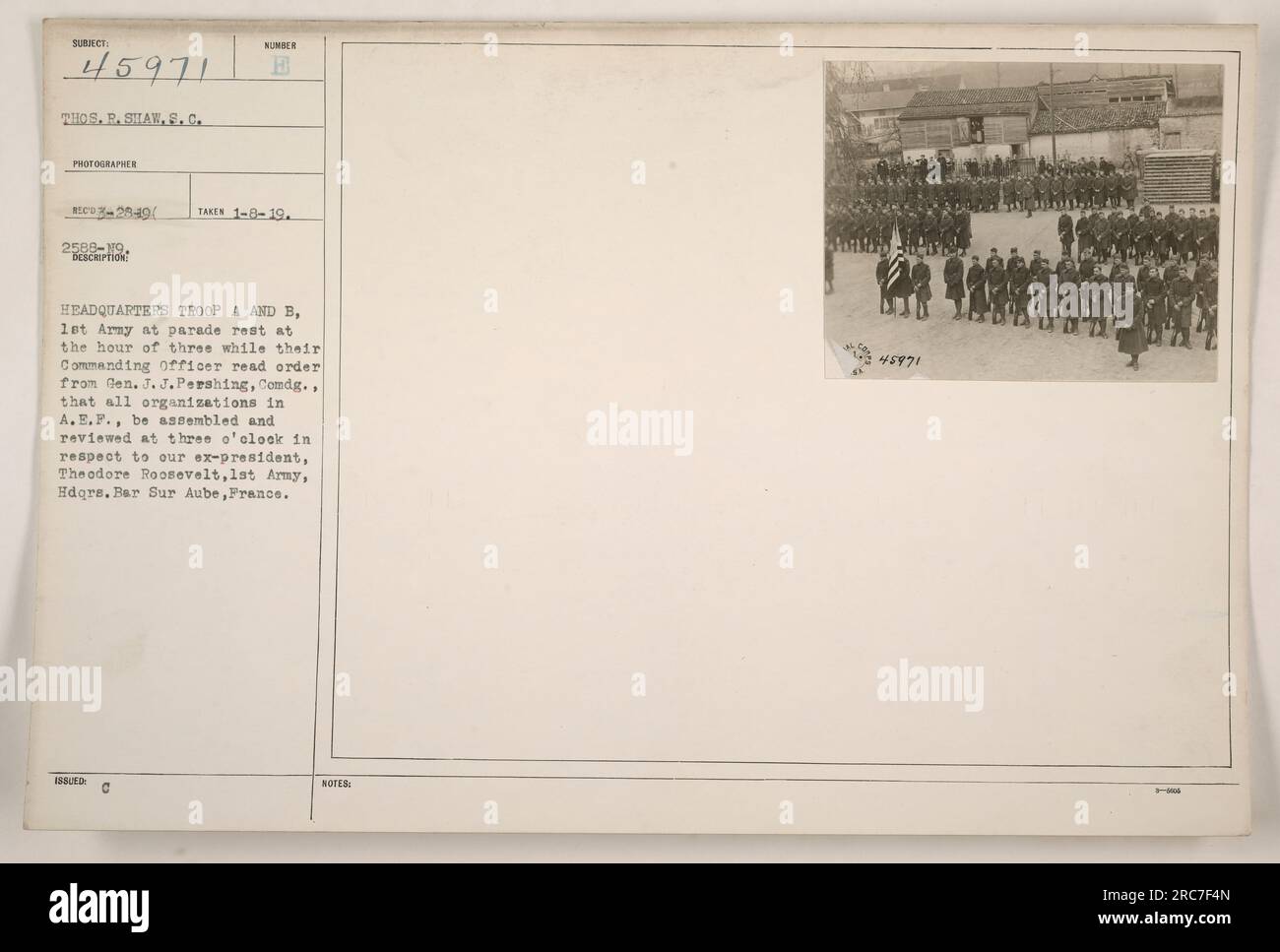 'A photograph of headquarters Troop A and B of the 1st Army at parade rest, awaiting the reading of an order from General J.J. Pershing. The order instructed all organizations in the A.E.F. to assemble and be reviewed at three o'clock in honor of ex-president Theodore Roosevelt. Taken at Hdqrs. Bar Sur Aube, France on January 8th, 1919.' Stock Photo