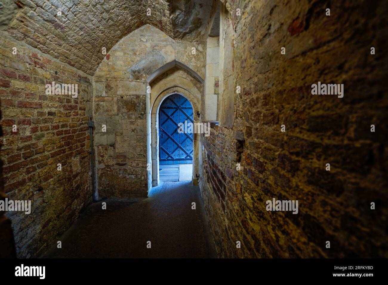 London, England, UK - July 16, 2022.Tower of London inside the historic castle corridors, medieval wood doors and old stone hallways with etchings. Stock Photo