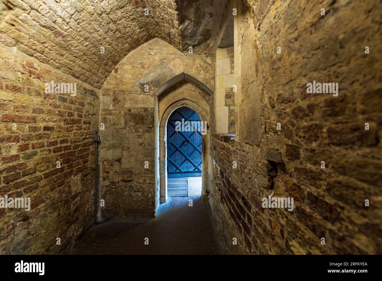 London, England, UK - July 16, 2022.The Tower of London interior, inside the historic castle, palace with medieval wood doors and old stone corridors. Stock Photo