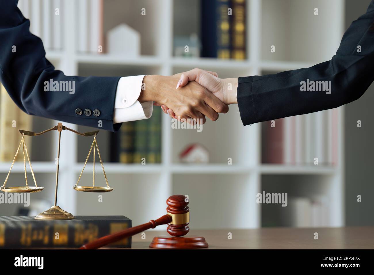 lawyer or judge shaking hands after agreeing to accept a bribe From cilent Stock Photo