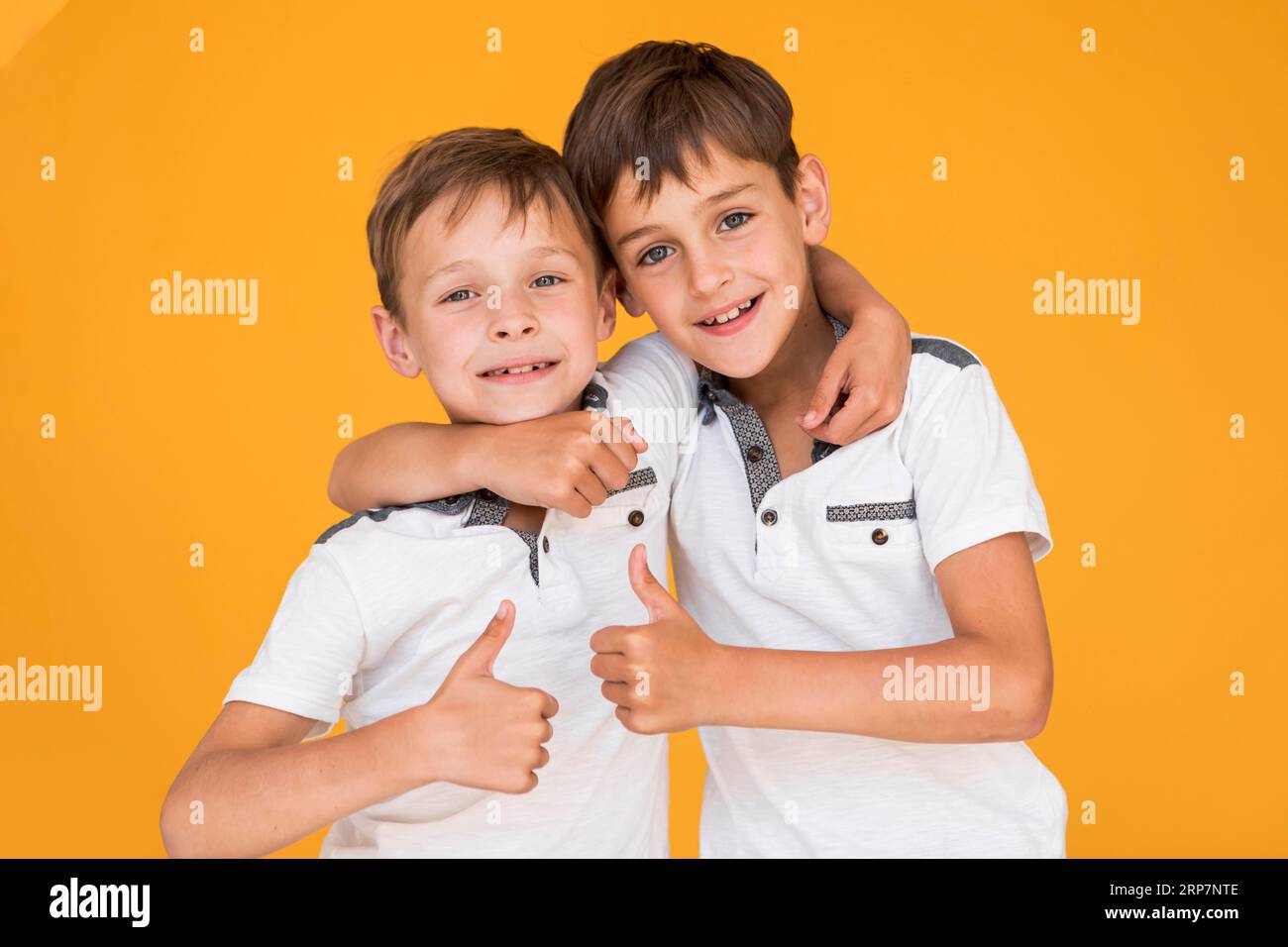 Little brothers holding each other Stock Photo - Alamy