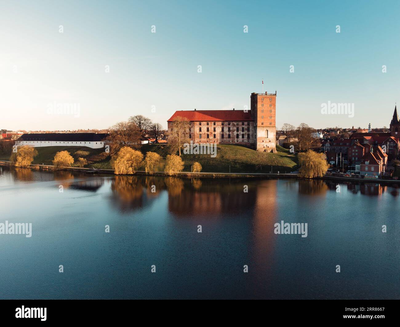 An aerial view of the historic Koldinghus Castle in Kolding, Denmark, with the lake in the foreground Stock Photo