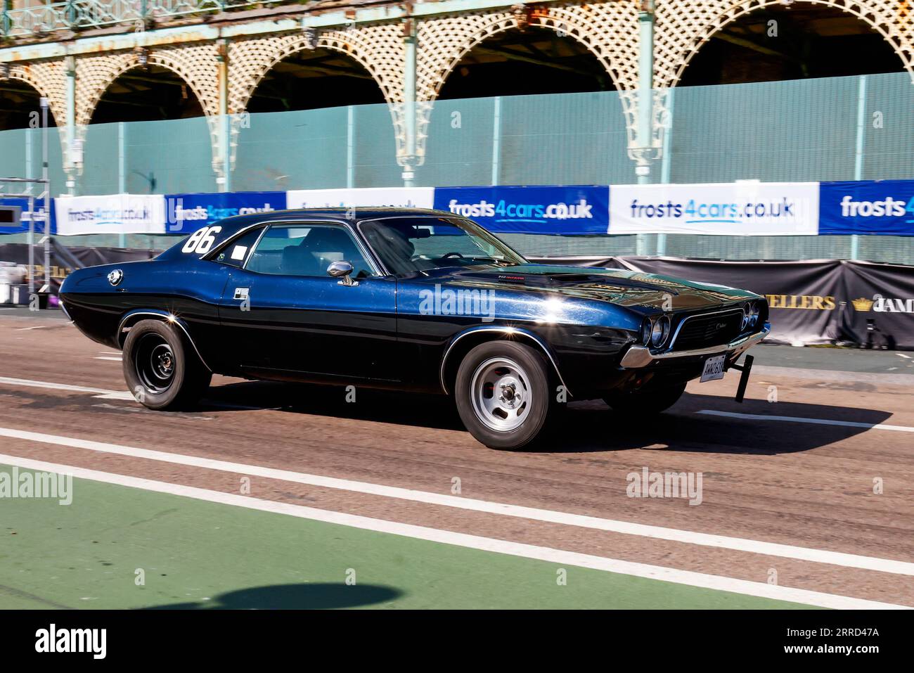 Madeira Drive, Brighton, City of Brighton & Hove, East Sussex UK. The Frosts Brighton Speed Trials is an exhilarating, action-packed day for spectators and participants alike. Over one hundred cars line up to take a timed run down Madeira Drive.  Numerous categories including road cars & race cars compete to win the fastest in their class along a quarter mile straight. This image features Adam Le Roy driving a Dodge Challenger. 2nd September 2023 Stock Photo