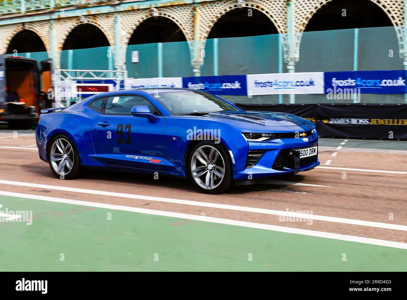 Madeira Drive, Brighton, City of Brighton & Hove, East Sussex UK. The Frosts Brighton Speed Trials is an exhilarating, action-packed day for spectators and participants alike. Over one hundred cars line up to take a timed run down Madeira Drive.  Numerous categories including road cars & race cars compete to win the fastest in their class along a quarter mile straight. This image features David Manser driving a Chevrolet Camaro SS. 2nd September 2023 Stock Photo