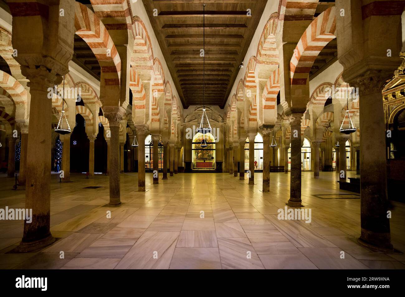 Hypostyle Prayer Hall in the Mezquita (The Great Mosque) with columns of jasper, onyx, marble, and granite supporting double arches in Cordoba, Spain Stock Photo