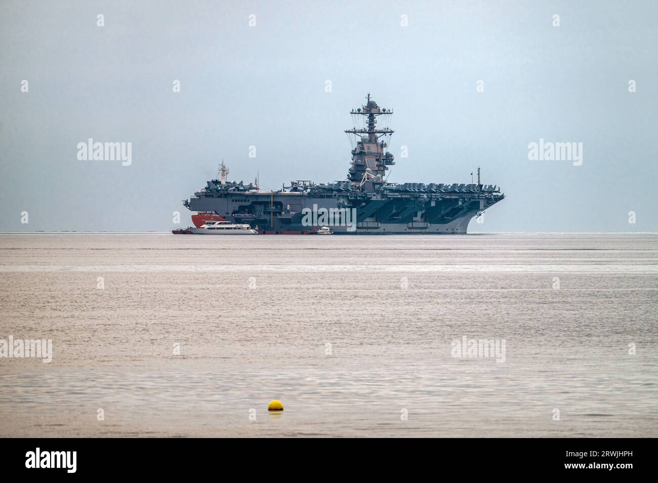 Trieste, Italy. 18th Sep, 2023. US Navy aircraft carrier USS Gerald R. Ford anchored at the Gulf of Trieste. The USS Gerald R. Ford is the largest warship in the world. Credit: SOPA Images Limited/Alamy Live News Stock Photo