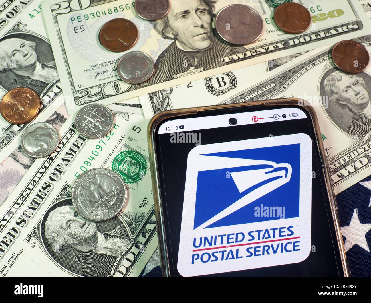 Germany. 22nd Sep, 2023. In this photo illustration, United States Postal Service, USPS logo seen displayed on a smartphone with United States Dollar Currencies on the table. Credit: SOPA Images Limited/Alamy Live News Stock Photo