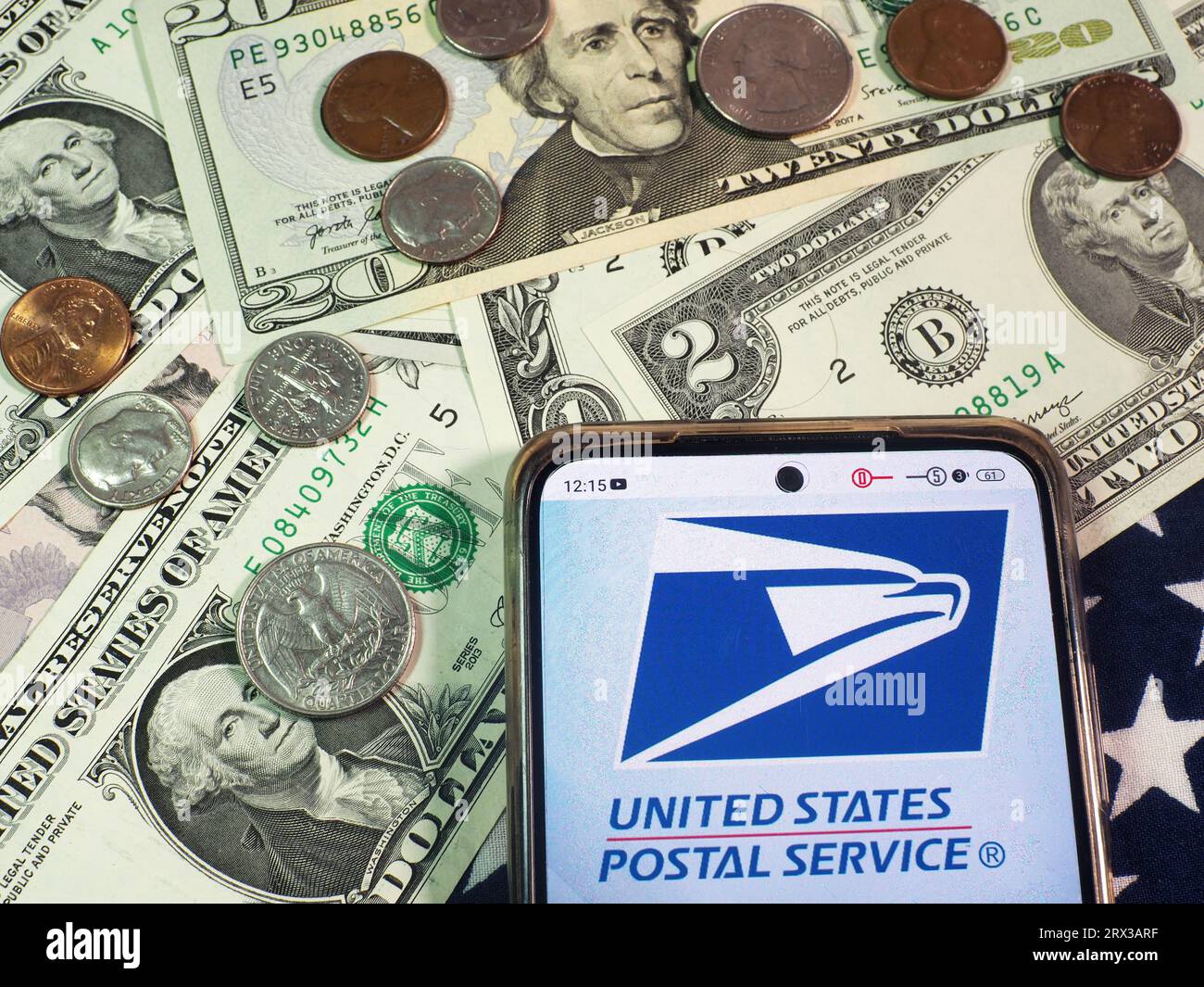 Germany. 22nd Sep, 2023. In this photo illustration, United States Postal Service, USPS logo seen displayed on a smartphone with United States Dollar Currencies on the table. (Photo by Igor Golovniov/SOPA Images/Sipa USA) *** Strictly for editorial news purposes only *** Credit: Sipa USA/Alamy Live News Stock Photo