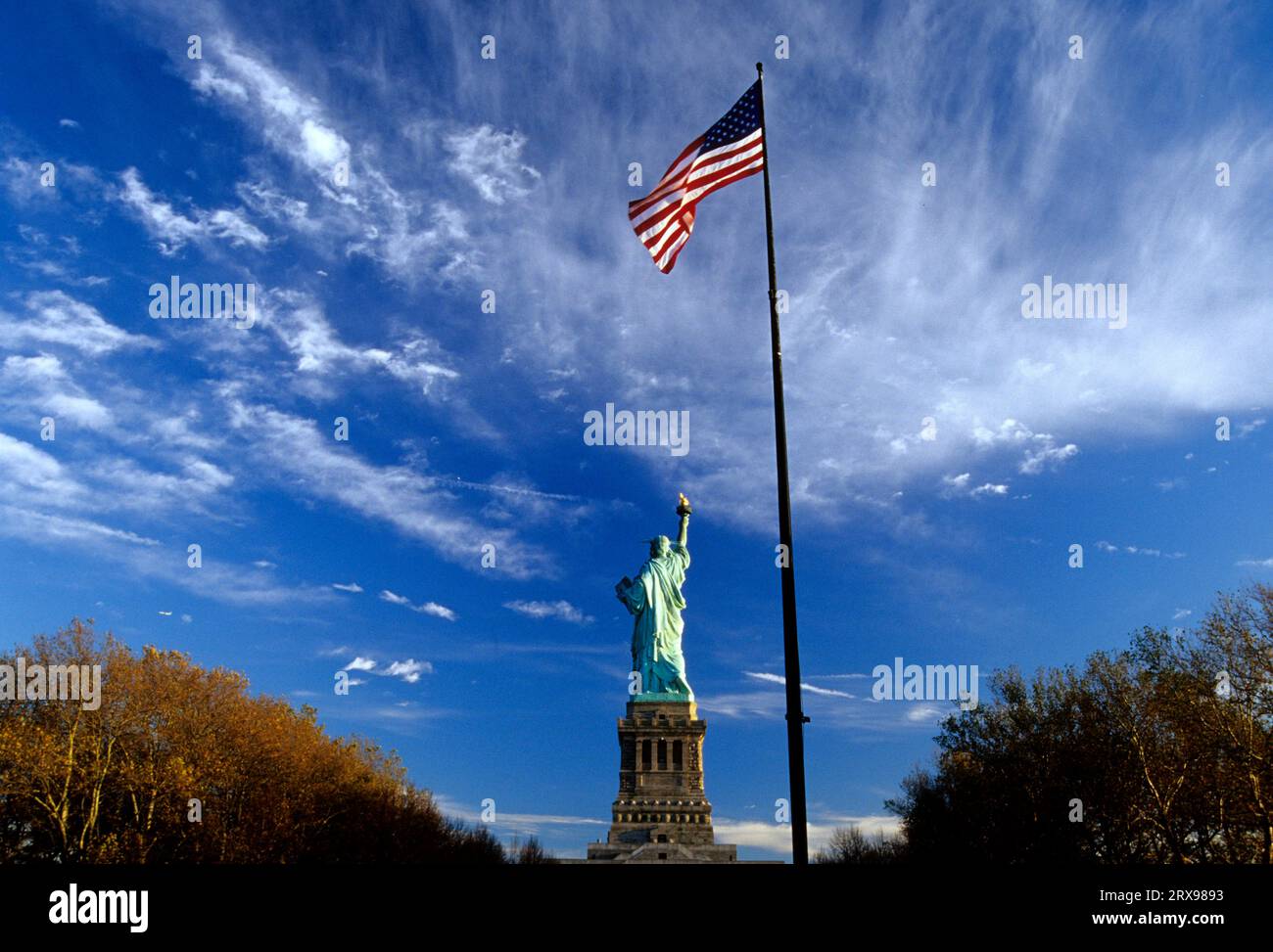 Statue of Liberty with American flag, Statue of Liberty National Monument, New York Stock Photo