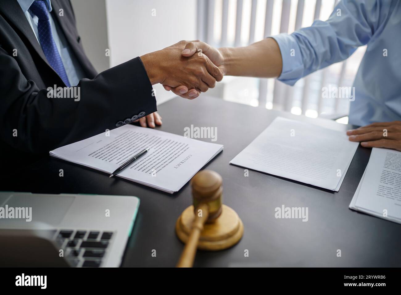 Lawyer Legal counsel Businessman shaking hands successful making a deal. mans handshake. Business partnership meeting concept. Stock Photo