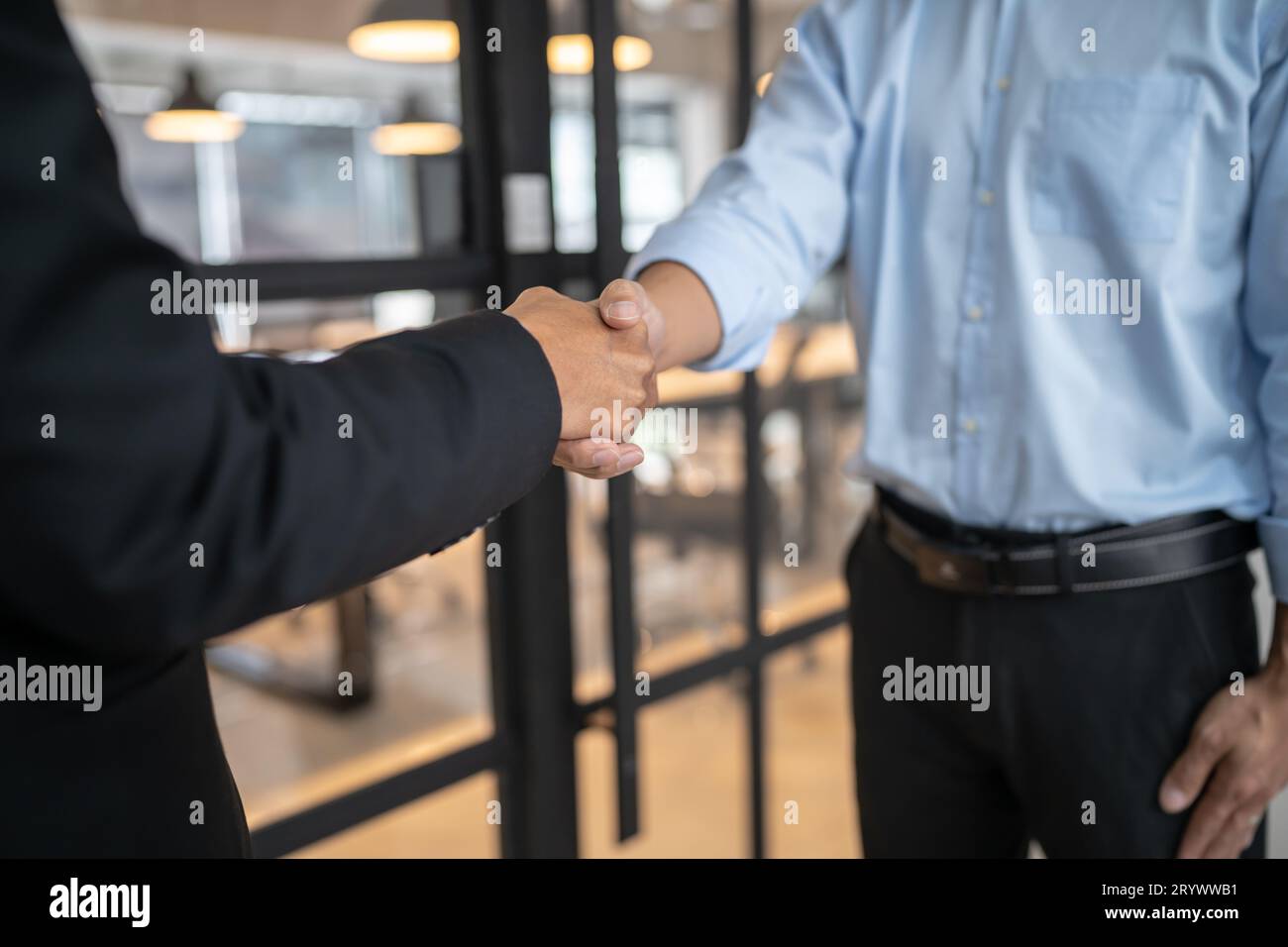 Lawyer Legal counsel Businessman shaking hands successful making a deal. mans handshake. Business partnership meeting concept. Stock Photo