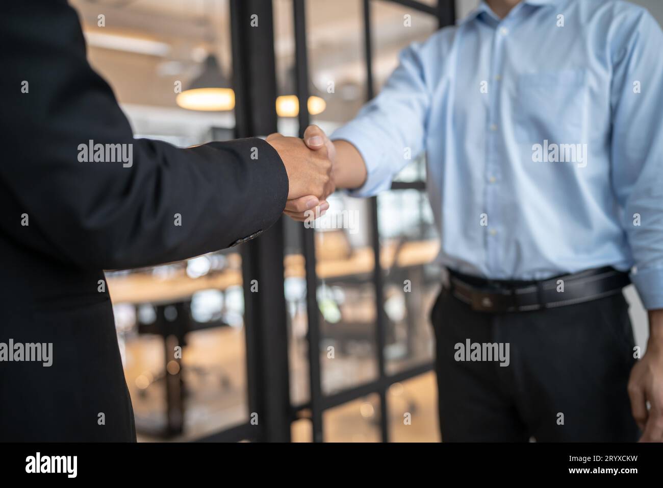 Lawyer Legal counsel Businessman shaking hands successful making a deal. mans handshake. Business partnership meeting concept. Stock Photo