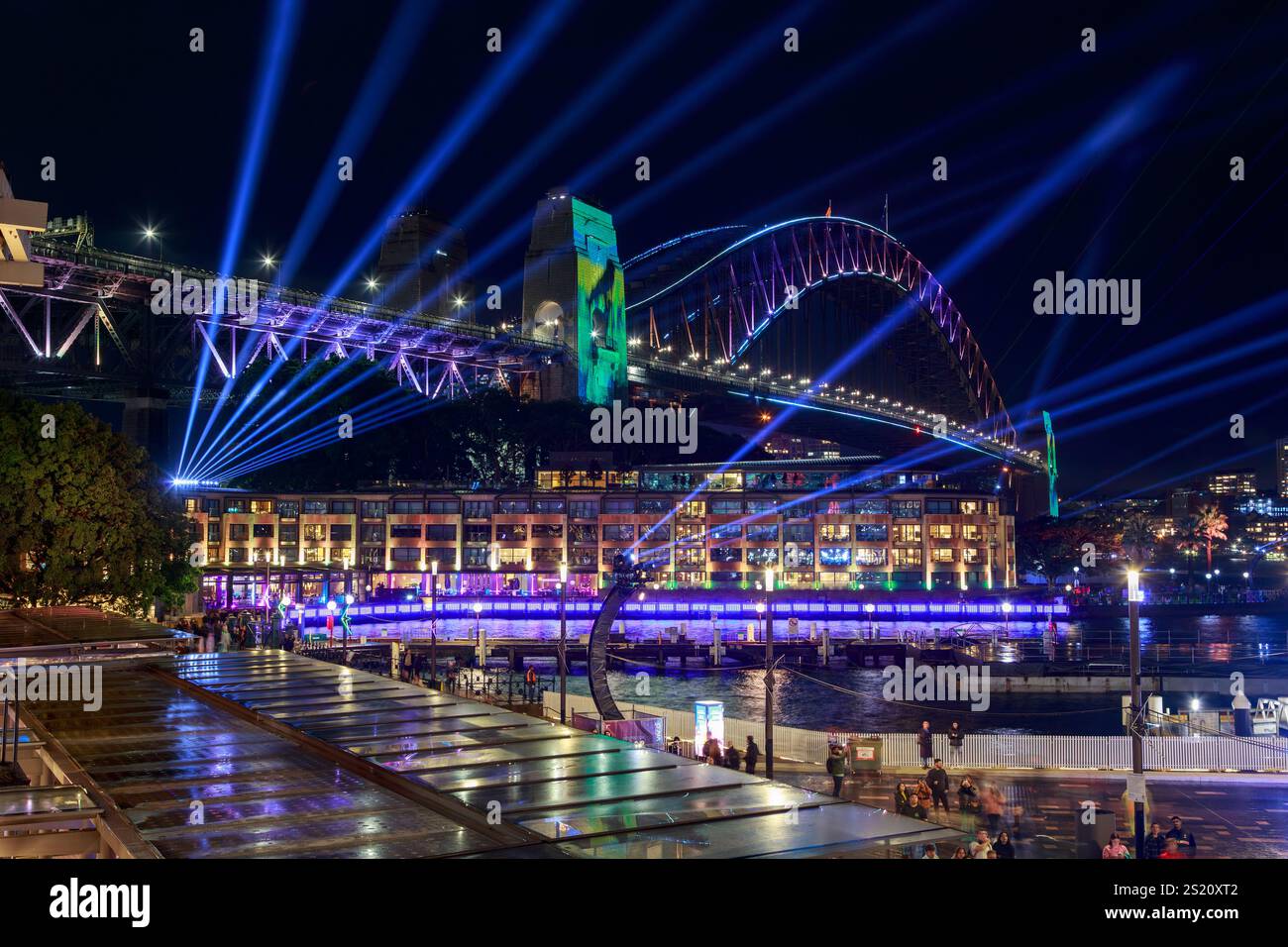 The Sydney Harbour Bridge and Campbells Cove illuminated for the annual 'Vivid Sydney' festival. Sydney, Australia Stock Photo