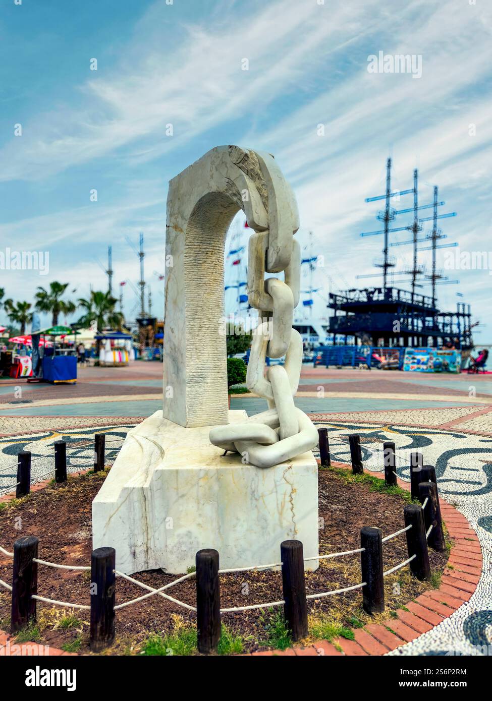 Alanya Saatli Meydan, Matusan: Exquisite gardens with pebble mosaics and a chain as a symbol of the fishing harbor, a sign of tradition and maritime solidarity, Alanya, Turkey Stock Photo