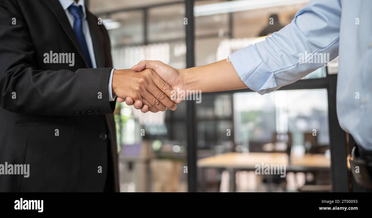 Lawyer Legal counsel Businessman shaking hands successful making a deal. mans handshake. Business partnership meeting concept. Stock Photo