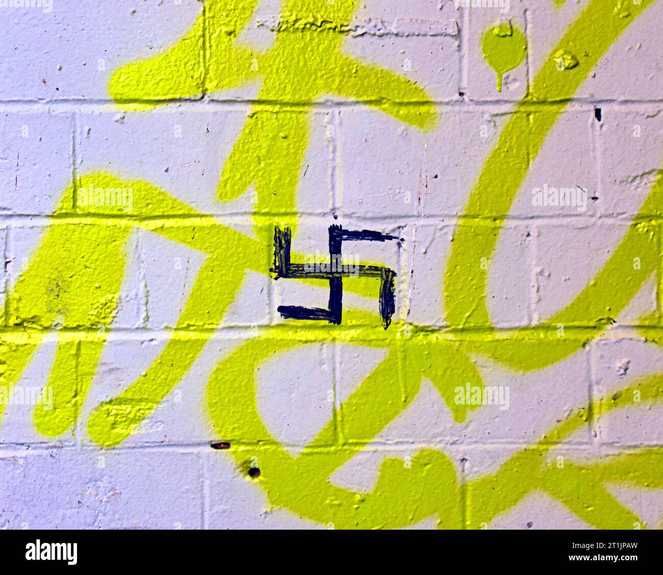 Nazi swastika symbol graffiti scrawled on a wall Stock Photo