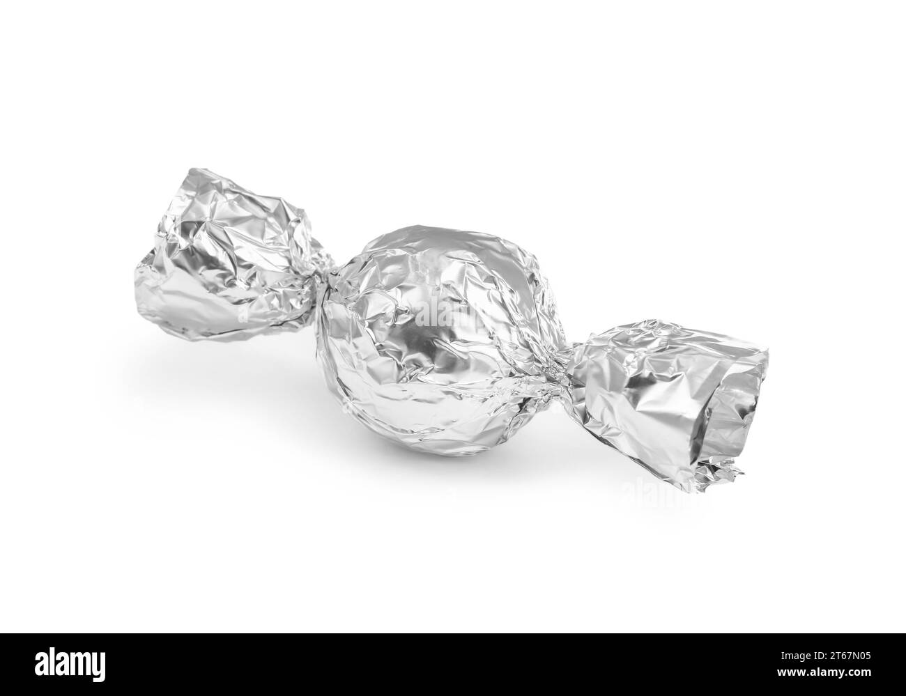 Tasty candy in silver wrapper isolated on white Stock Photo