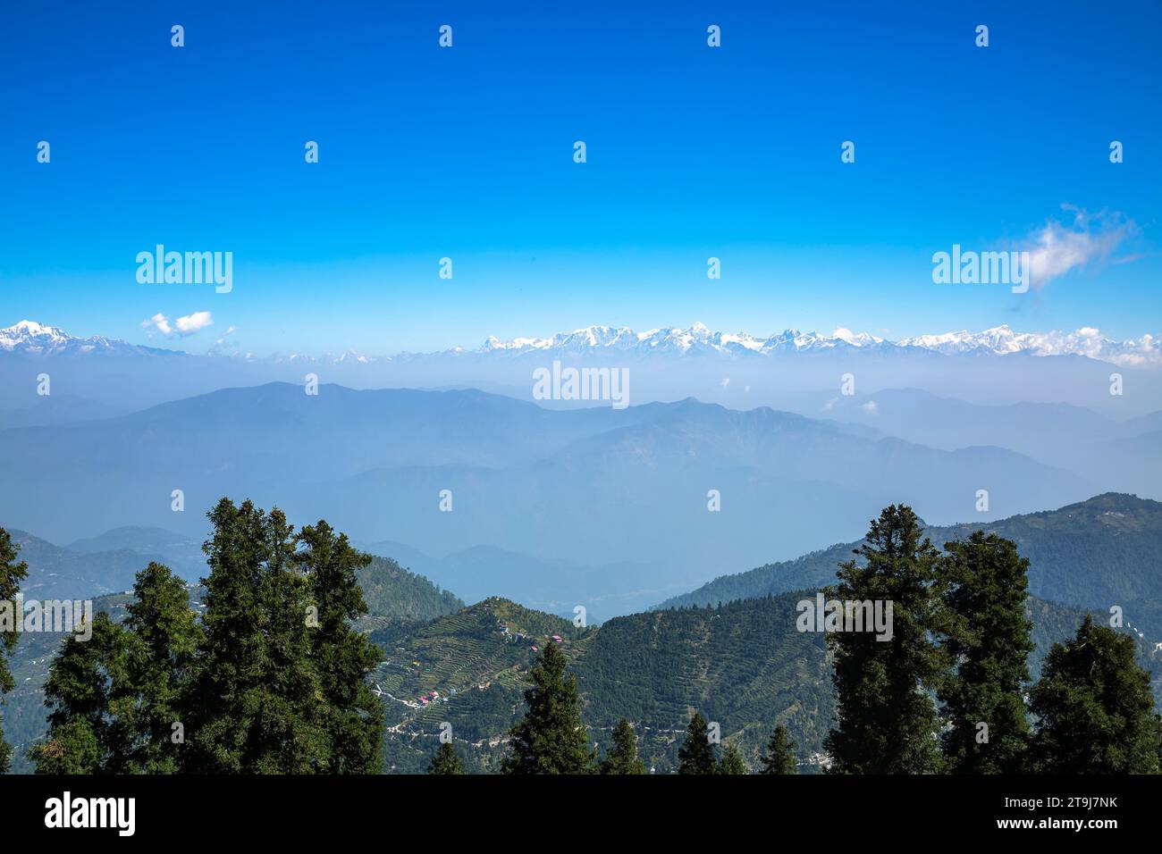 snow capped Himalayas from Tehri range in Dhanaulti tehsil of Tehri Garhwal district in Uttarakhand, India. Stock Photo