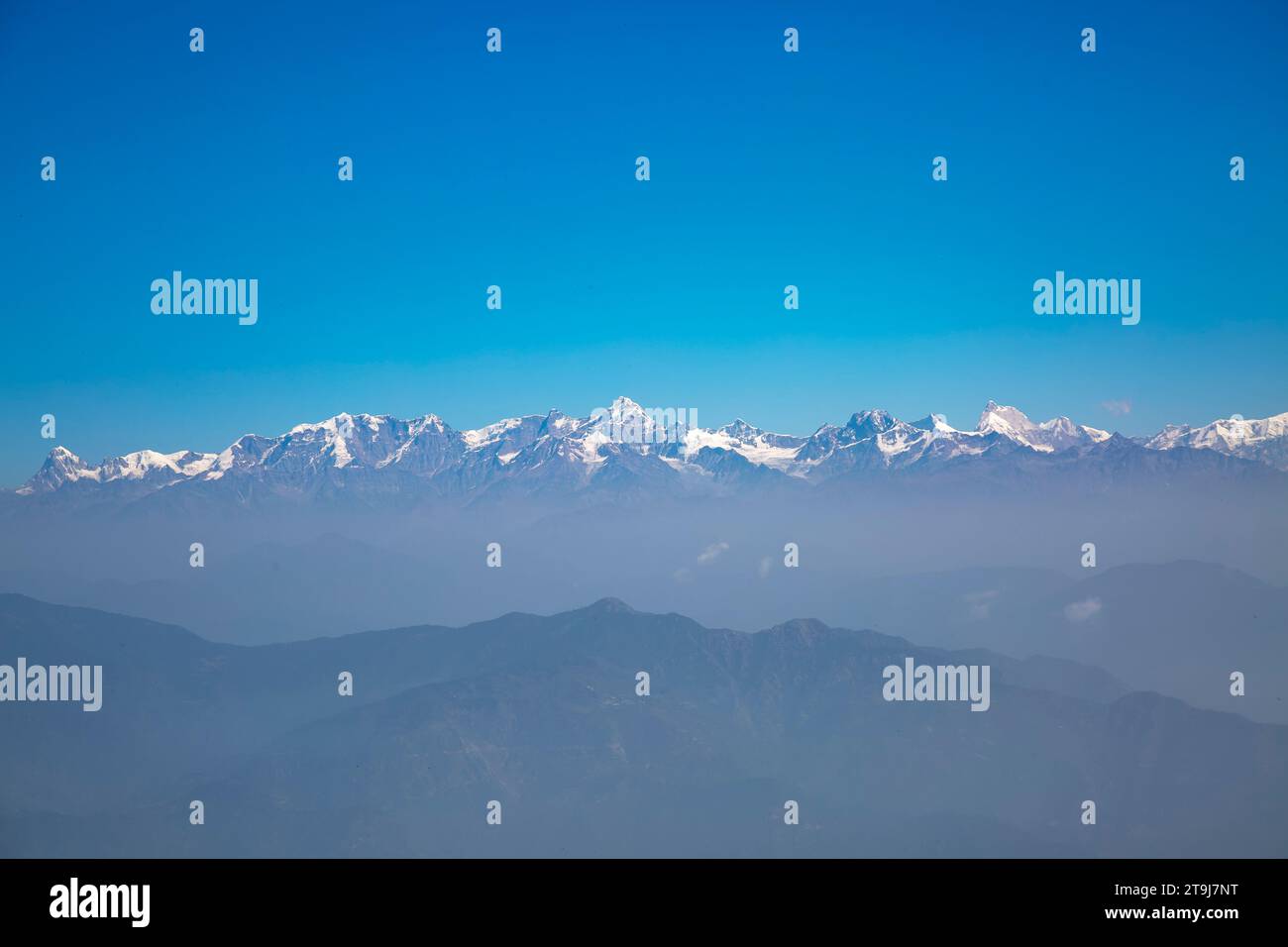 snow capped Himalayas from Tehri range in Dhanaulti tehsil of Tehri Garhwal district in Uttarakhand, India. Stock Photo