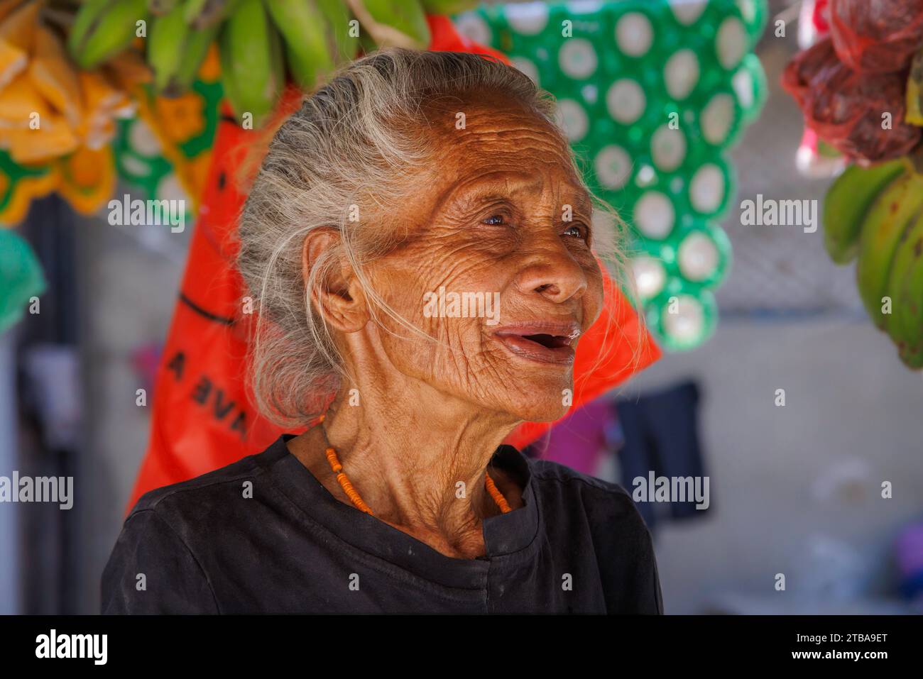 An old woman with a weathered face in a market, Baucau, The Democratic Republic of Timor-Leste. Stock Photo