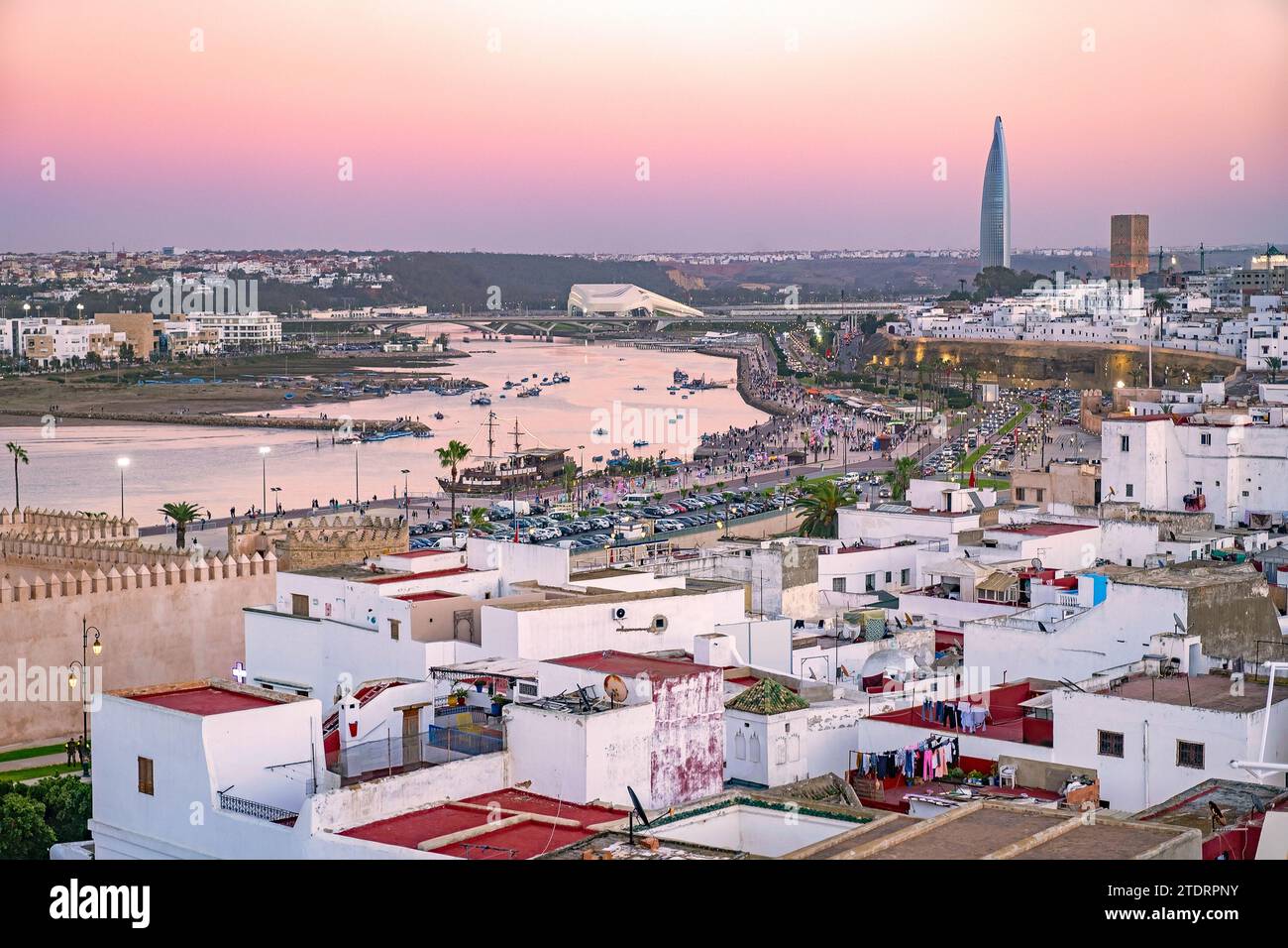 Aerial view over the river Bou Regreg, medina, Hassan Tower and Mohammed VI Tower in the city Rabat at sunset, Rabat-Salé-Kénitra, Morocco Stock Photo