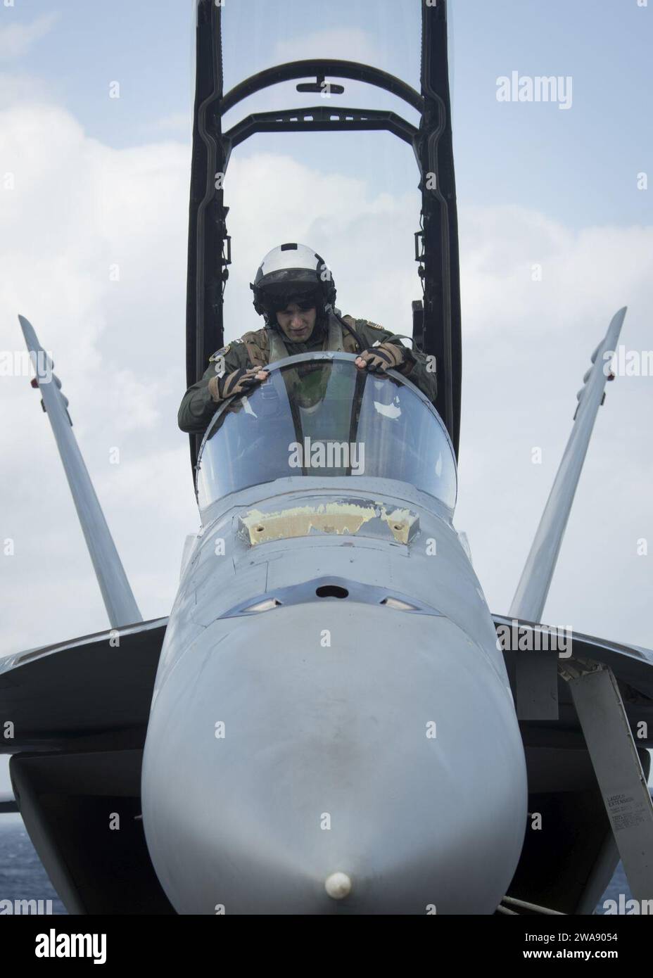 US military forces. 180113TF680-0724 ATLANTIC OCEAN (Jan. 13, 2018) Lt. John Bauman, assigned to the 'Black Lions' of Strike Fighter Squadron  (VFA) 213, climbs inside an F/A18F Super Hornet during flight operations aboard the USS Gerald R. Ford (CVN 78). Ford is underway conducting test and evaluation operations. (U.S. Navy photo by Mass Communication Specialist 3rd Class Ryan Carter/Released) Stock Photo