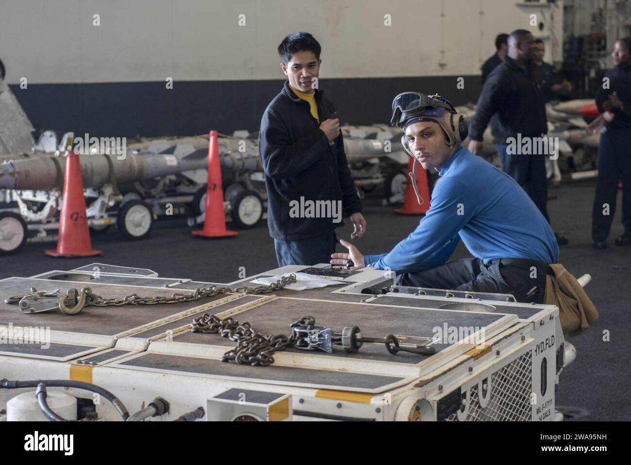 US military forces. 180507DZ642-0012 MEDITERRANEAN SEA (May 7, 2018) Aviation Boatswain's Mate (Handling) Airman Tyler Williams prepares to move an aircraft in the hangar bay aboard the Nimitz-class aircraft carrier USS Harry S. Truman (CVN 75). As the Carrier Strike Group 8 flag ship, Truman's support of Operation Inherent Resolve demonstrates the capability and flexibility of U.S. Naval Forces, and its resolve to eliminate the terrorist group ISIS and the threat it poses. (U.S. Navy photo by Mass Communication Specialist 2nd Class Bobby Siens/Released) Stock Photo