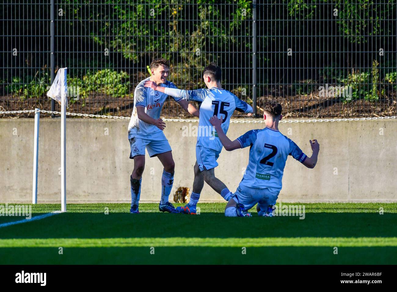 Landore, Swansea, Wales. 6 January 2024. Thomas Woodward of Swansea City celebrates scoring his side's fourth goal with team-mate Josh Pescatore and Jack Fanning during the Under 18 Professional Development League match between Swansea City and Ipswich Town at the Swansea City Academy in Landore, Swansea, Wales, UK on 6 January 2024. Credit: Duncan Thomas/Majestic Media/Alamy Live News. Stock Photo