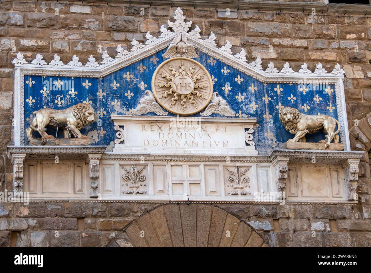 Florence, Italy, July 25, 2023. Marble decoration with two lions and fleur de lis above the door of the Palazzo Vecchio Stock Photo