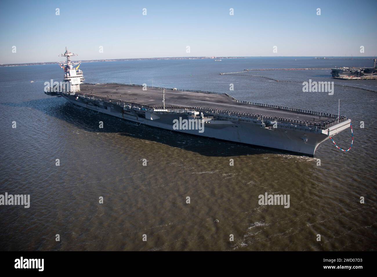 The world’s largest aircraft carrier USS Gerald R. Ford (CVN 78), arrives in Norfolk, Virginia, following its eight-month maiden deployment, Jan. 18, 2023. The Gerald R. Ford Carrier Strike Group (GRFCSG) completed a scheduled deployment in U.S. Naval Forces Europe-Africa/US Sixth Fleet area of operations, demonstrating the commitment and power projection capability of the Navy’s globally deployed force. (U.S. Navy photo by Mass Communication Specialist 2nd Class Jacob Mattingly) Stock Photo