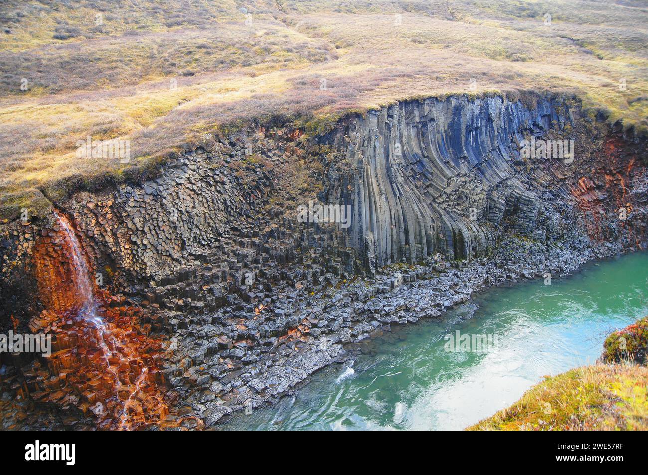 Basalt Rock Columns and Glacial River at Studlagil Canyon, Jokuldalur, East Iceland Stock Photo