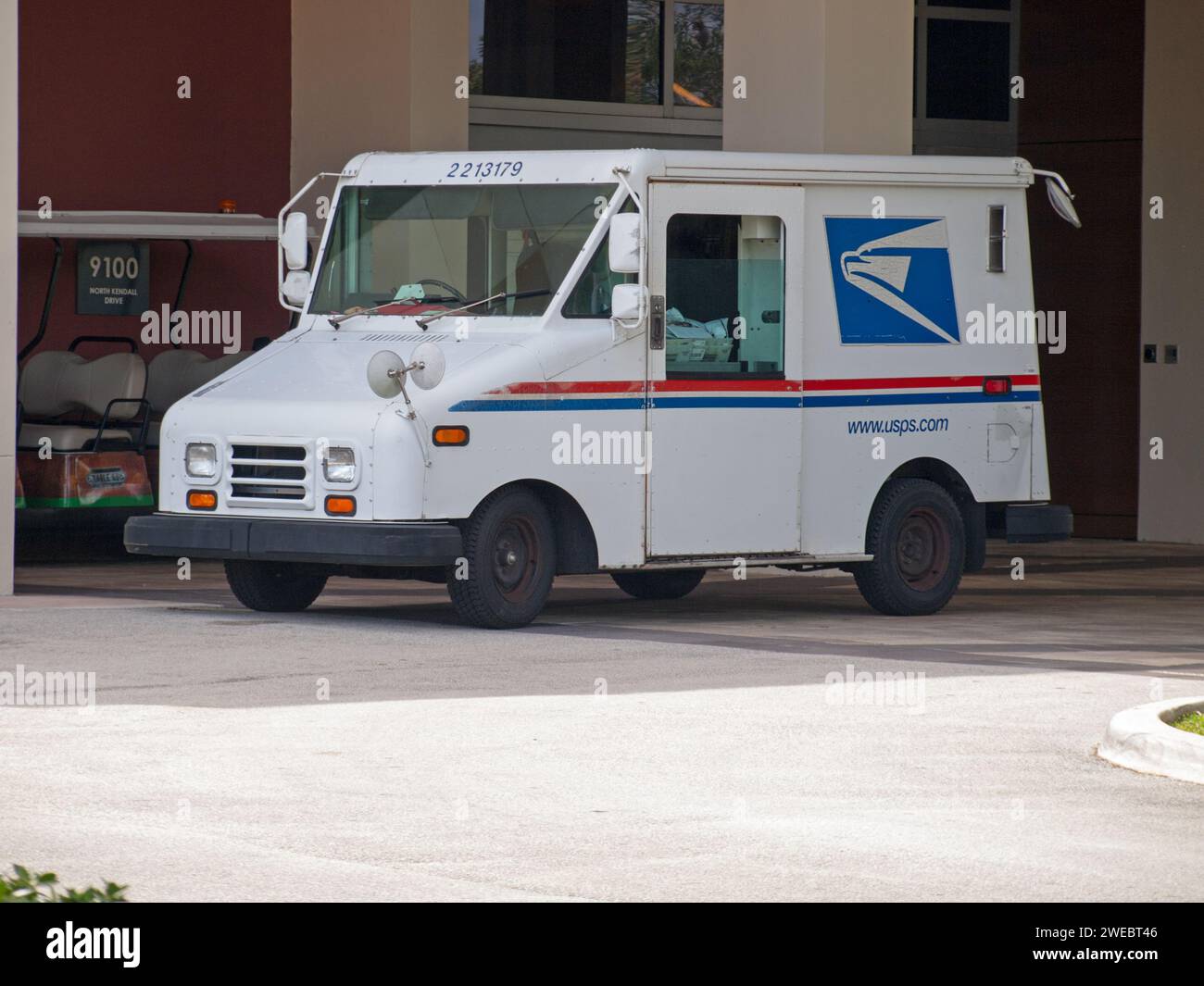 Miami, Florida, United States - December 1, 2023: Delivery vehicle of the US Postal Service. Stock Photo