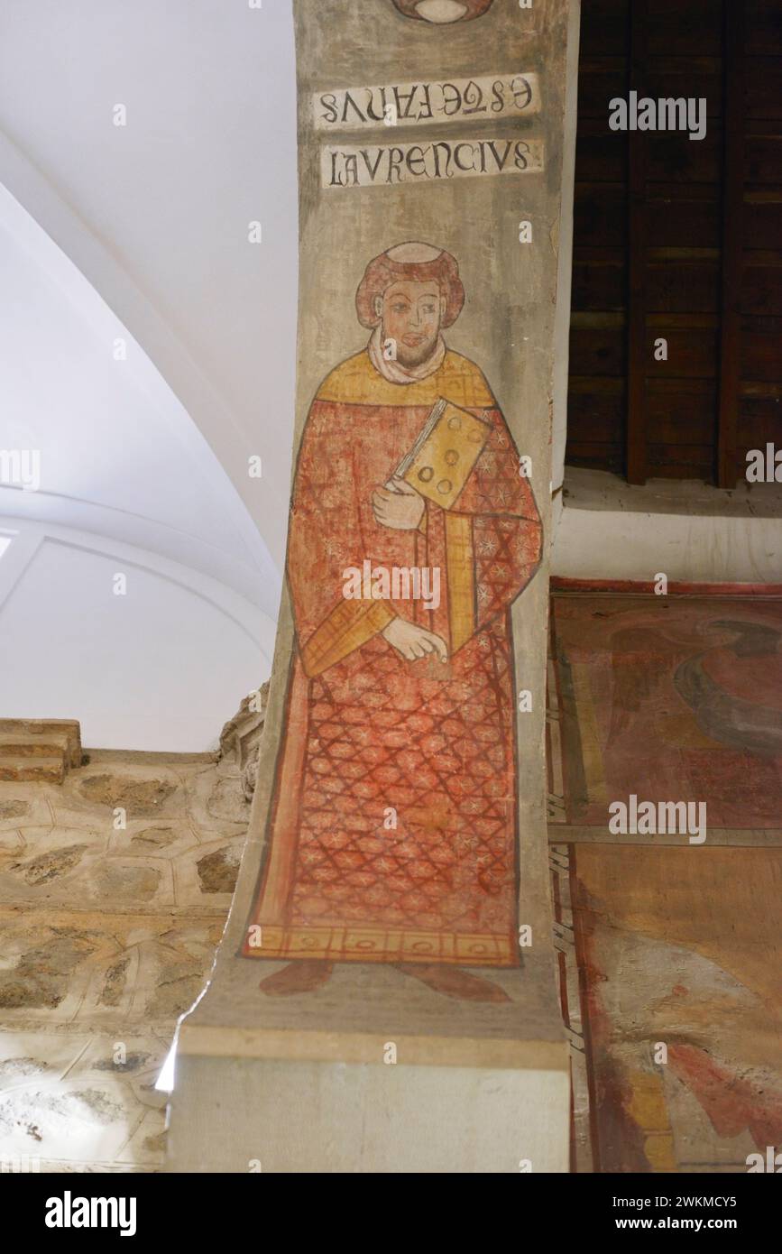 Spain, Toledo. Church of San Román. Built in Mudejar style in the 13th century. Wall painting in the intrados of one of the arches, depicting St. Lawrence (Laurentius), deacon martyr. Stock Photo