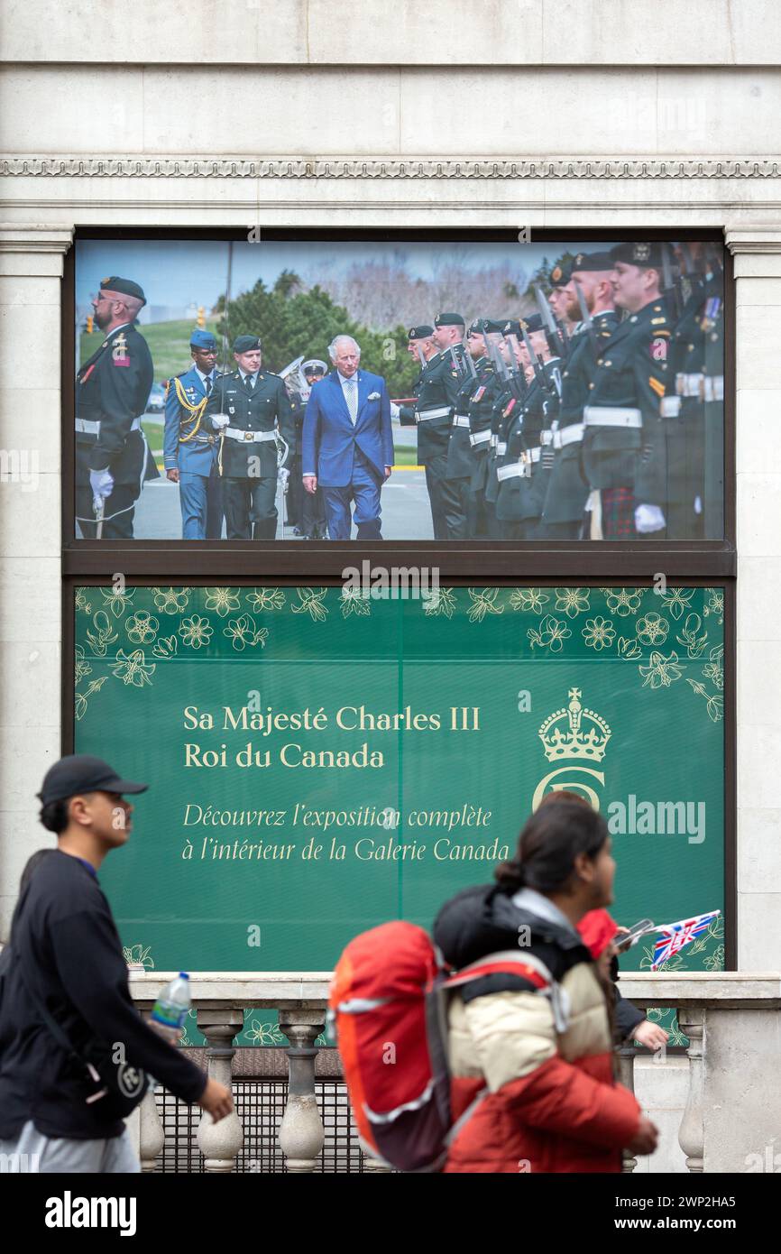 People gather to view the coronation of King Charles III in London ...