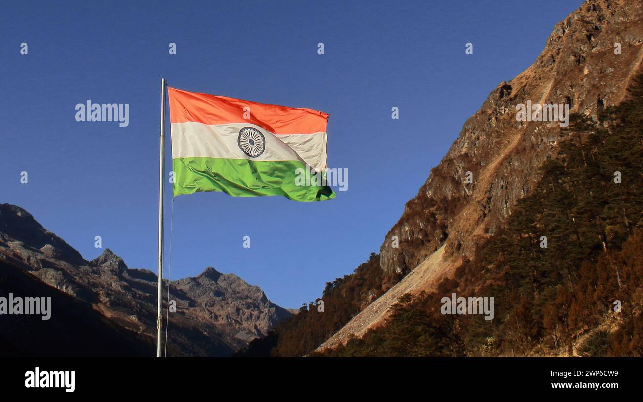 beautiful tri-color indian national flag flying in the sky near bum la pass, india china international border (mcmahon line) Stock Photo