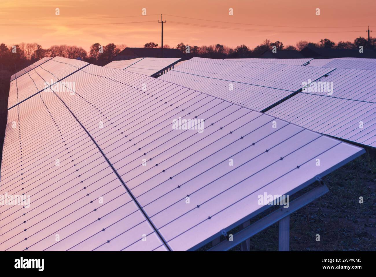 Solar Electric Station With Evening Sunlight. Long Rows Of Panels For ...