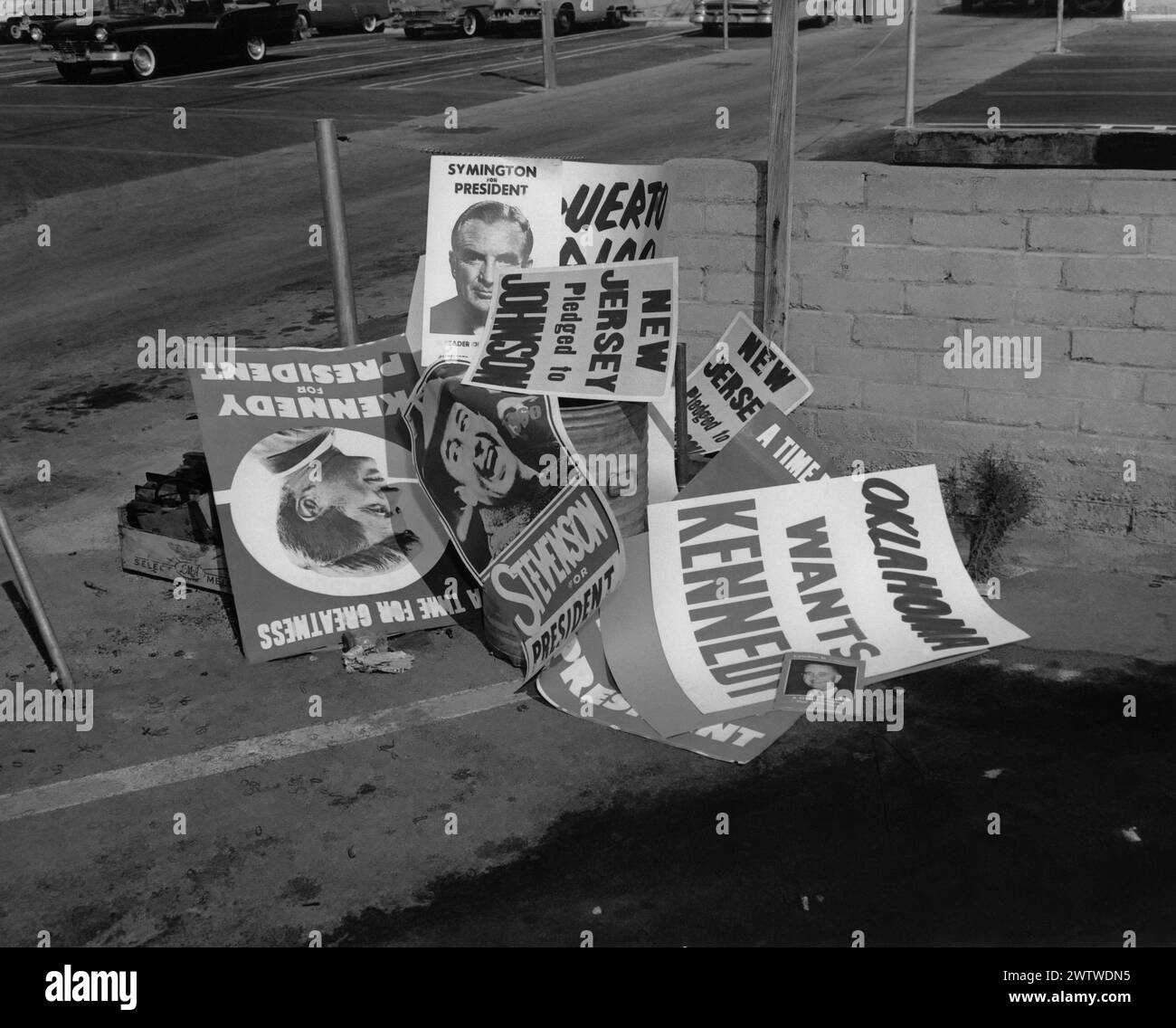 Pile of campaign posters sitting in a parking lot in 1959. John F ...