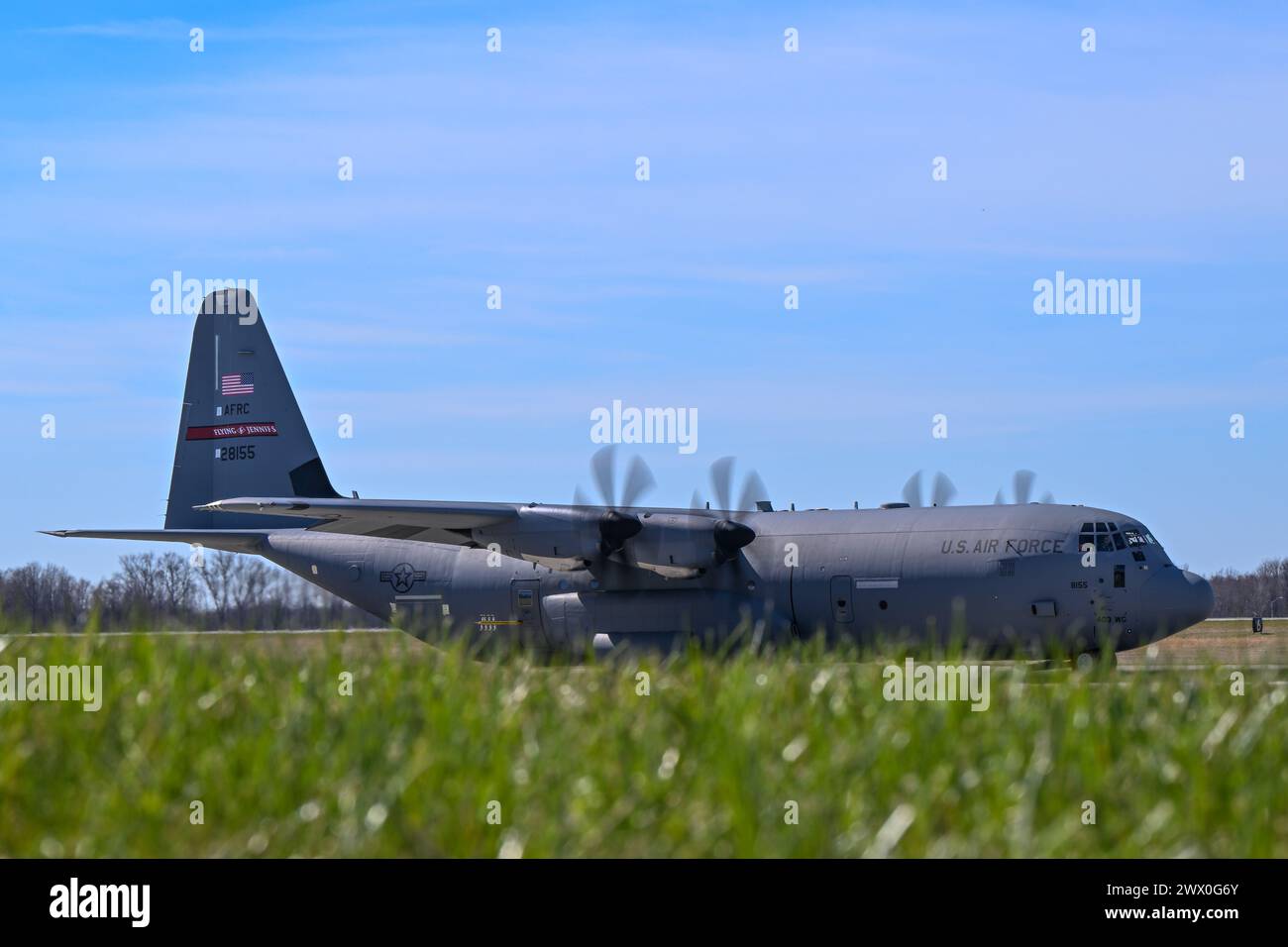 A C-130J-30 Super Hercules aircraft from Keesler Air Force Base, Mississippi, taxis to the runway at Youngstown Air Reserve Station, Ohio, as part of a flight test of the 910th Airlift Wing's unique electronic modular aerial spray system, March 25, 2024. The flight test was performed to ensure the operability of the spray system aboard the airframe as the 910th prepares to upgrade its aging C-130H Hercules fleet to new J-30 models. The project was carried out in partnership between 910th Airlift Wing maintenance personnel and aerial spray specialists, members of the Warner Robins Air Logistics Stock Photo