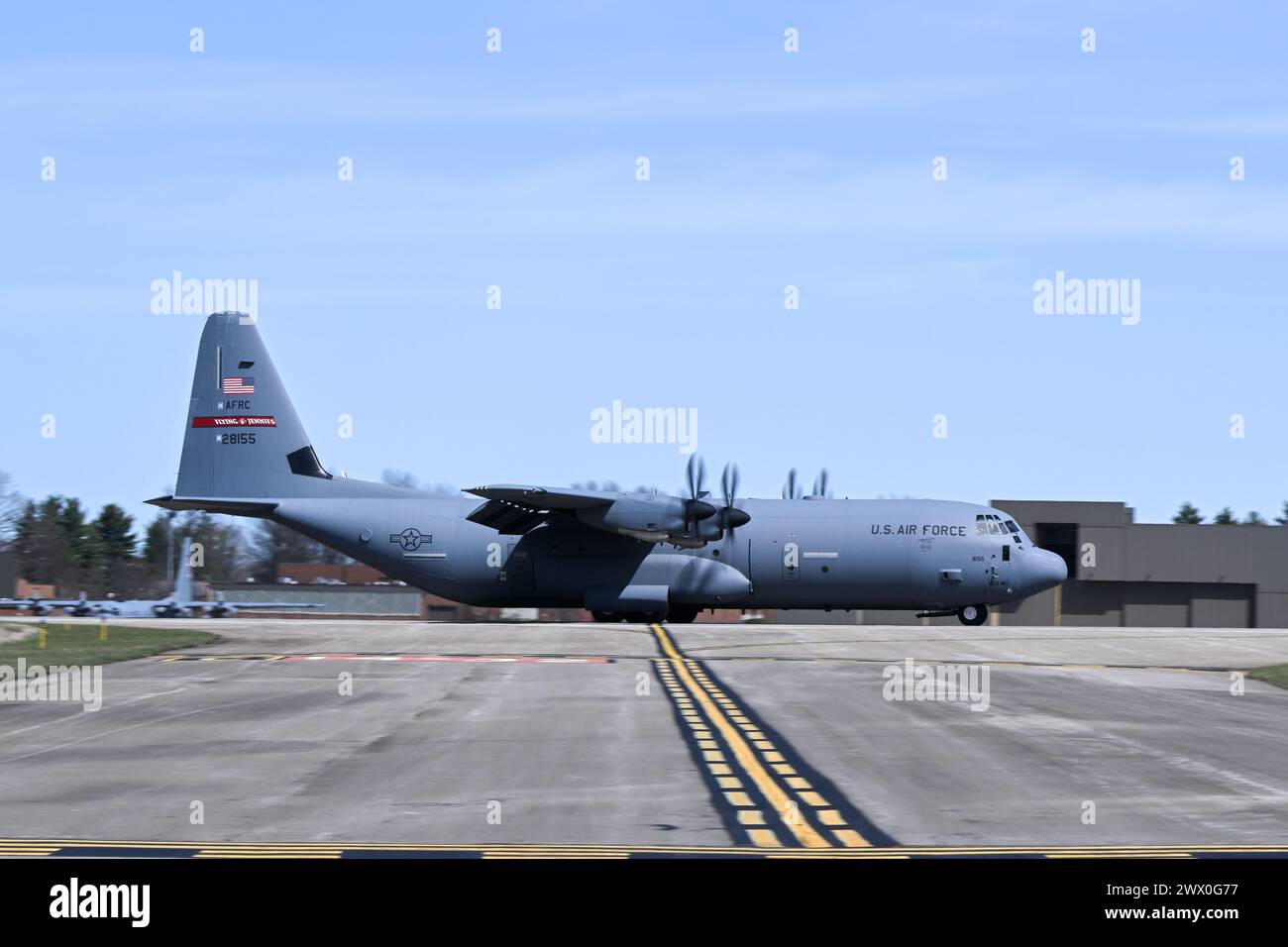 A C-130J-30 Super Hercules aircraft from Keesler Air Force Base, Mississippi, lands at Youngstown Air Reserve Station, Ohio, as part of a flight test of the 910th Airlift Wing's unique electronic modular aerial spray system, March 25, 2024. The flight test was performed to ensure the operability of the spray system aboard the airframe as the 910th prepares to upgrade its aging C-130H Hercules fleet to new J-30 models. The project was carried out in partnership between 910th Airlift Wing maintenance personnel and aerial spray specialists, members of the Warner Robins Air Logistics Complex C-130 Stock Photo