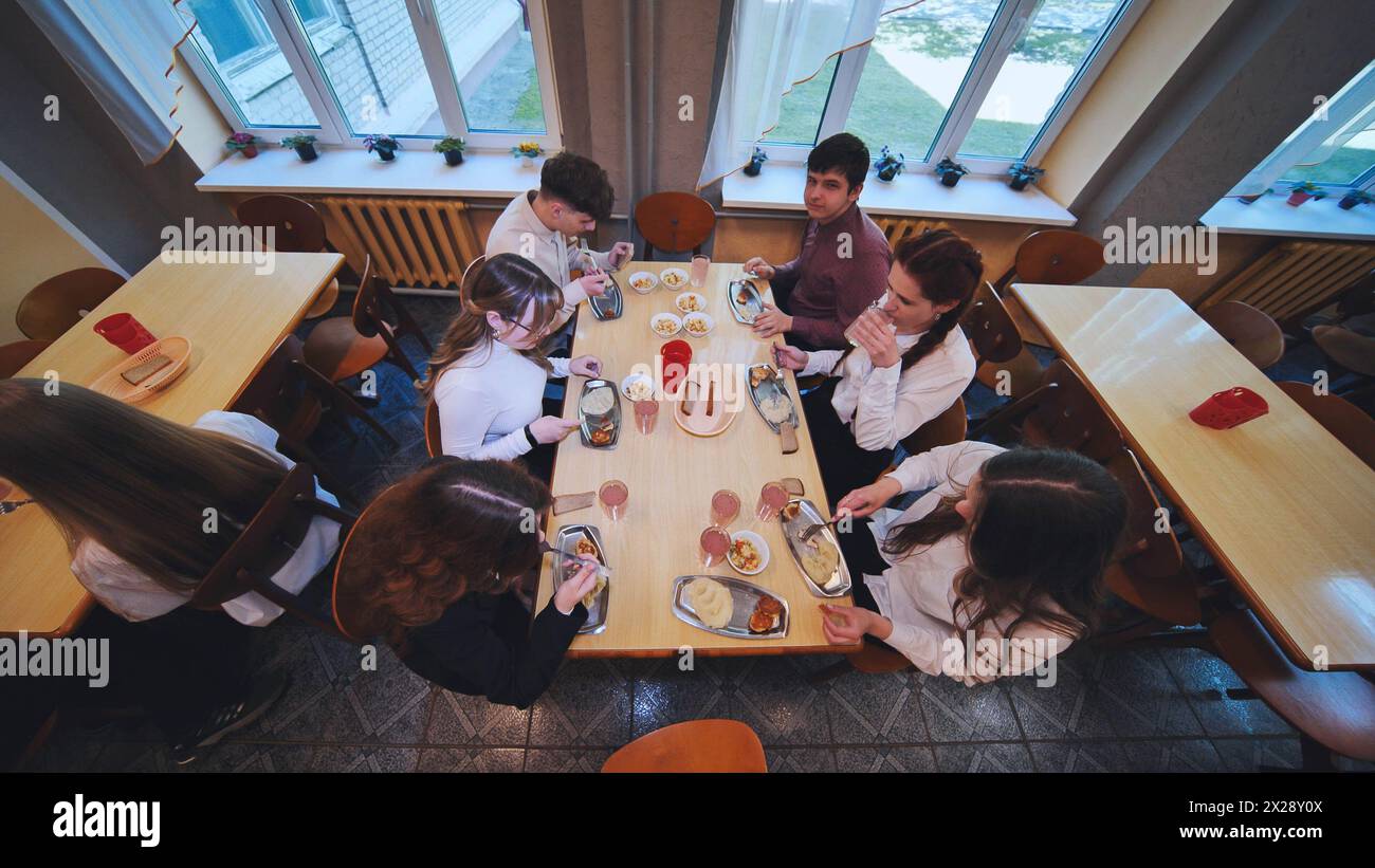 Children eat in the school canteen. Stock Photo