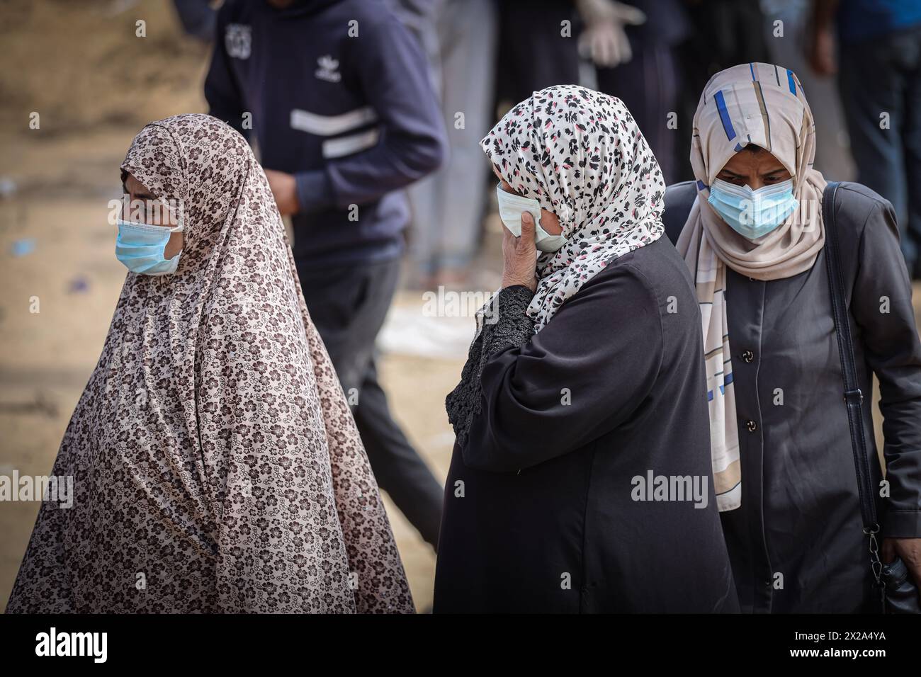 Gaza, Gaza, Palestine. 20th Apr, 2024. Palestinian women wait for the body of a relative to be exhumed to identify it (Credit Image: © Saher Alghorra/ZUMA Press Wire) EDITORIAL USAGE ONLY! Not for Commercial USAGE! Credit: ZUMA Press, Inc./Alamy Live News Stock Photo