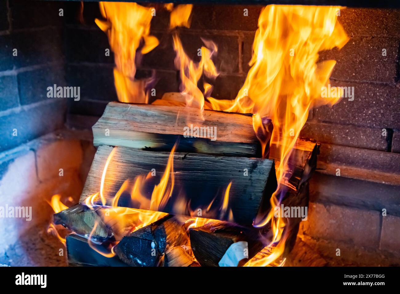 The comfort and warmth of the hearth, the dance of the flame in the stove. Stock Photo